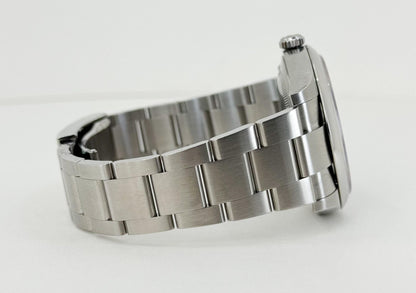 Rolex Oyster Perpetual 41 Watch - Domed Bezel - Turquoise Blue Celebration Motif Index Dial - Oyster Bracelet - 124300 - Luxury Time NYC